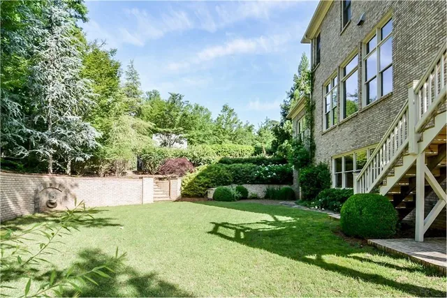 a view of a house with a yard and plants