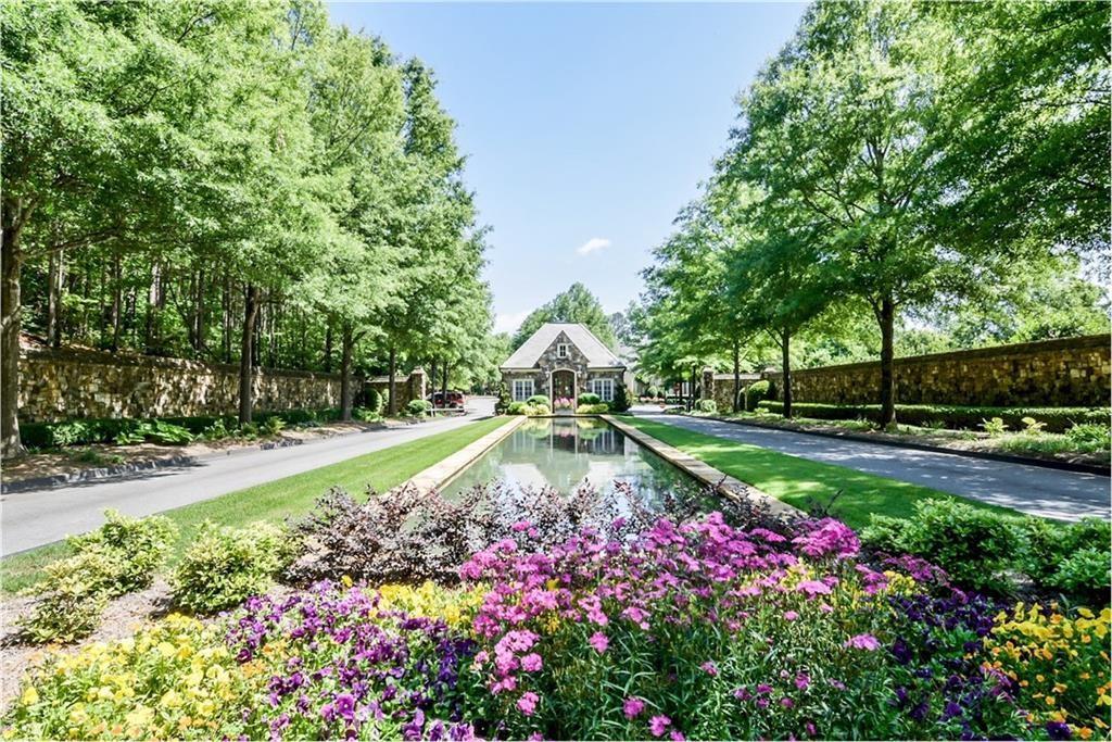 1620 High Trail Southeast Atlanta, GA 30339 - Photo 2 of 17 a view of a garden with large trees