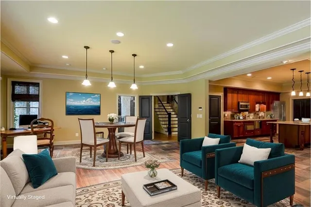 a living room with furniture a rug and a large window