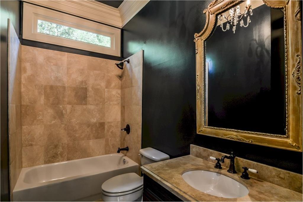 1620 High Trail Southeast Atlanta, GA 30339 - Photo 10 of 17 a bathroom with a granite countertop sink toilet and shower