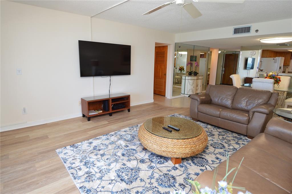 900 Gulf Boulevard, Unit 907 Indian Rocks Beach, FL 33785 - Photo 28 of 88 a living room with furniture and a flat screen tv