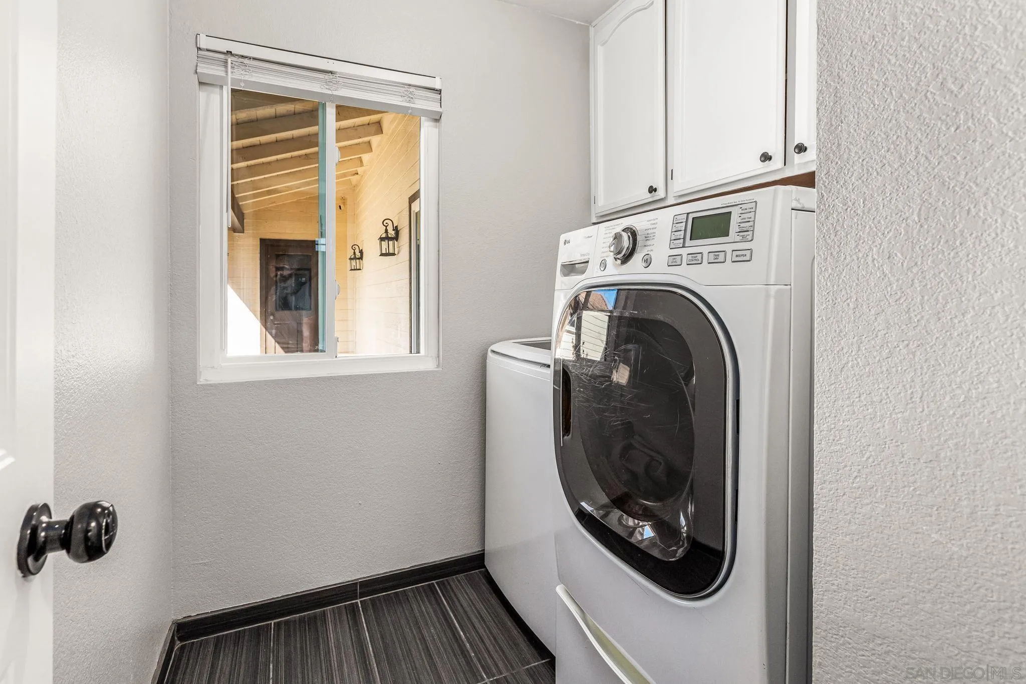16319 Scarbery Road Ramona, CA 92065 - Photo 16 of 37 a utility room with dryer and washer
