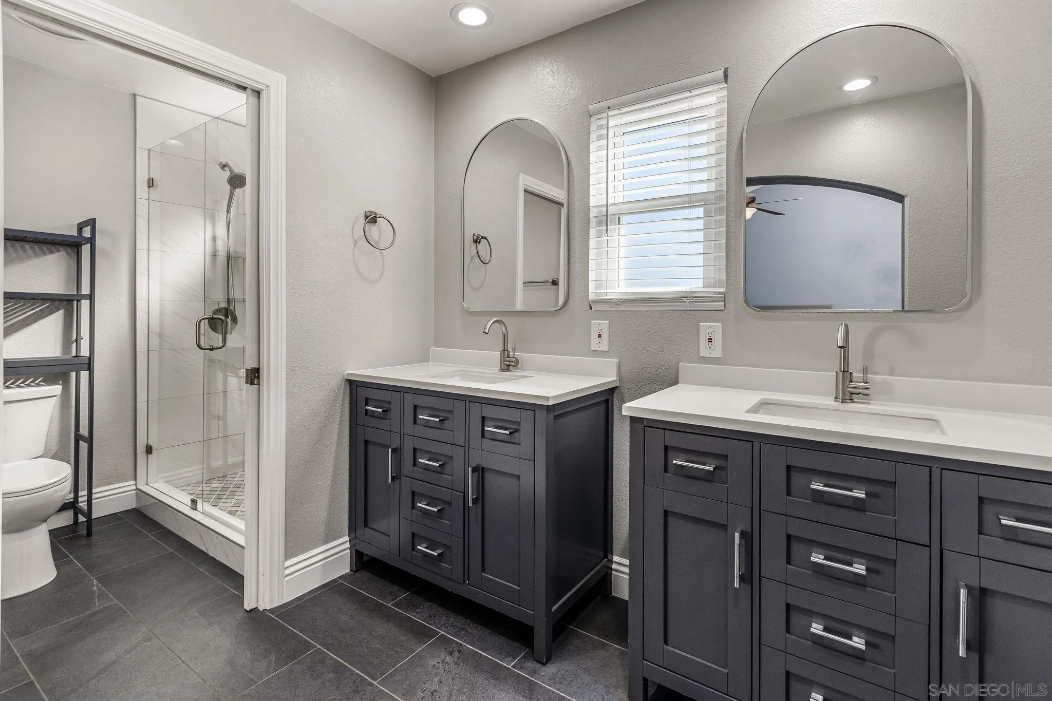 16319 Scarbery Road Ramona, CA 92065 - Photo 20 of 37 a spacious bathroom with a sink double vanity and a mirror