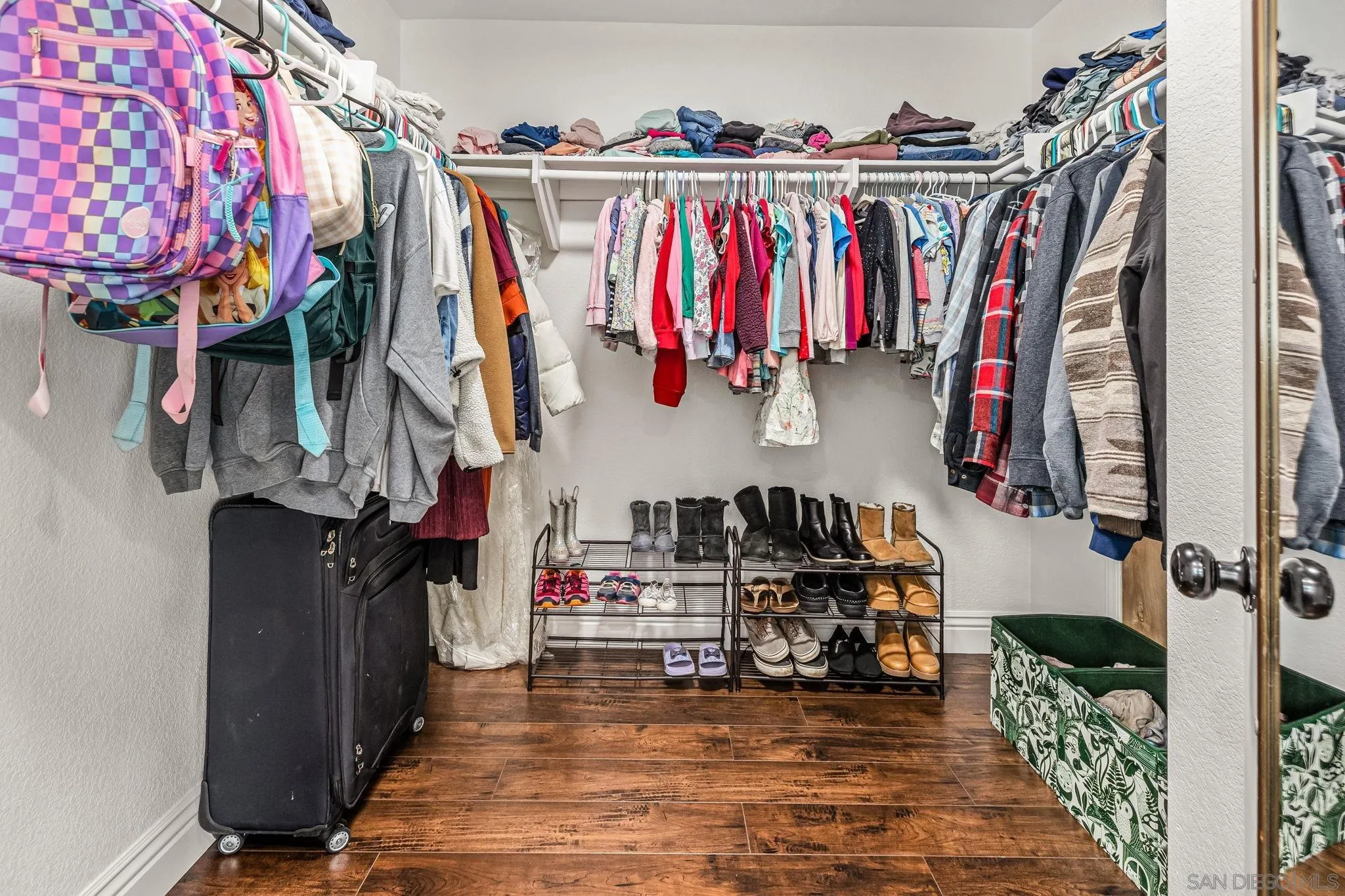 16319 Scarbery Road Ramona, CA 92065 - Photo 22 of 37 a view of walk in closet with clothes and shoes