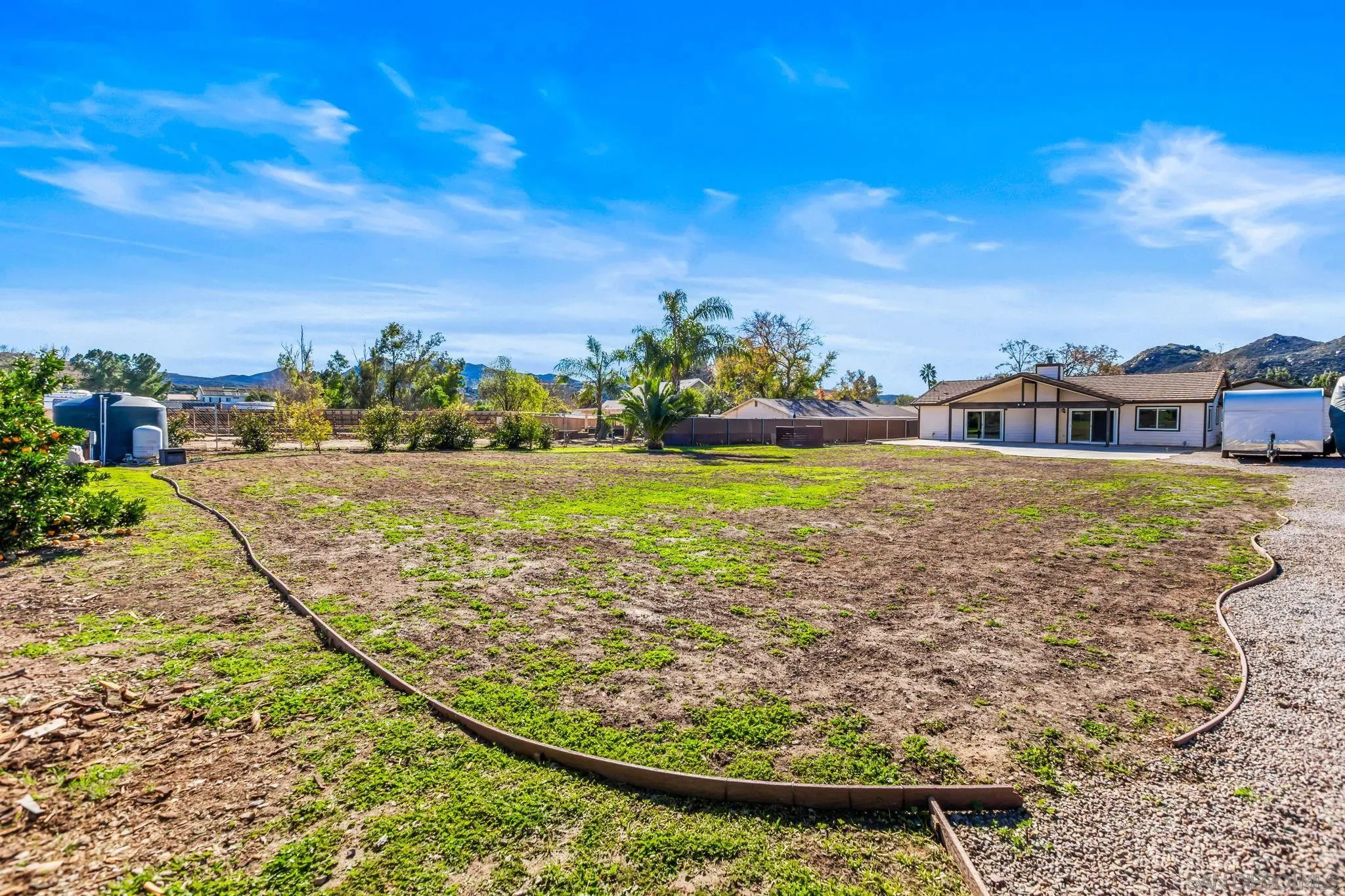 16319 Scarbery Road Ramona, CA 92065 - Photo 25 of 37 a view of a swimming pool with a lake view and mountain in the back