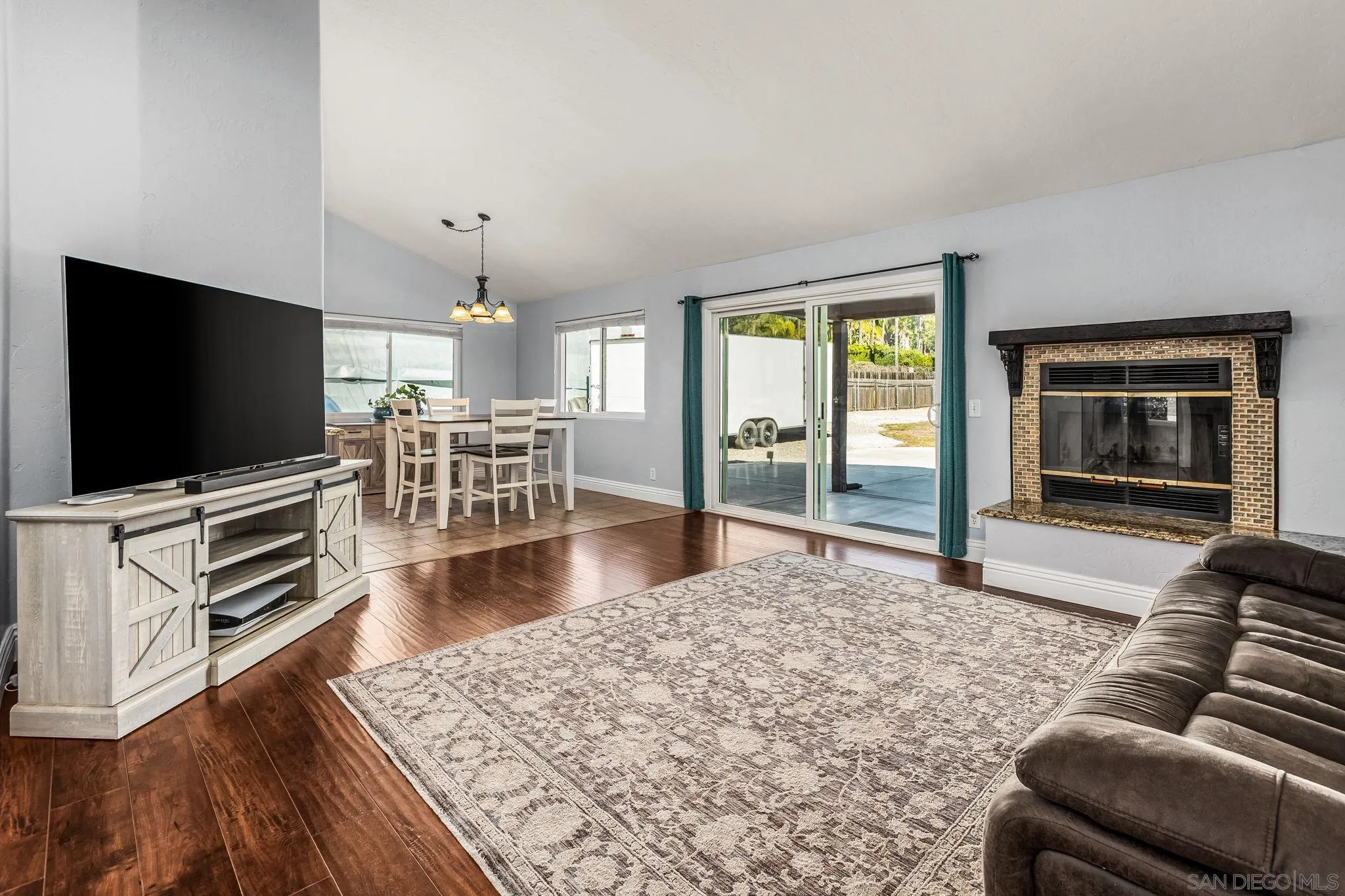16319 Scarbery Road Ramona, CA 92065 - Photo 3 of 37 a living room with furniture and a flat screen tv