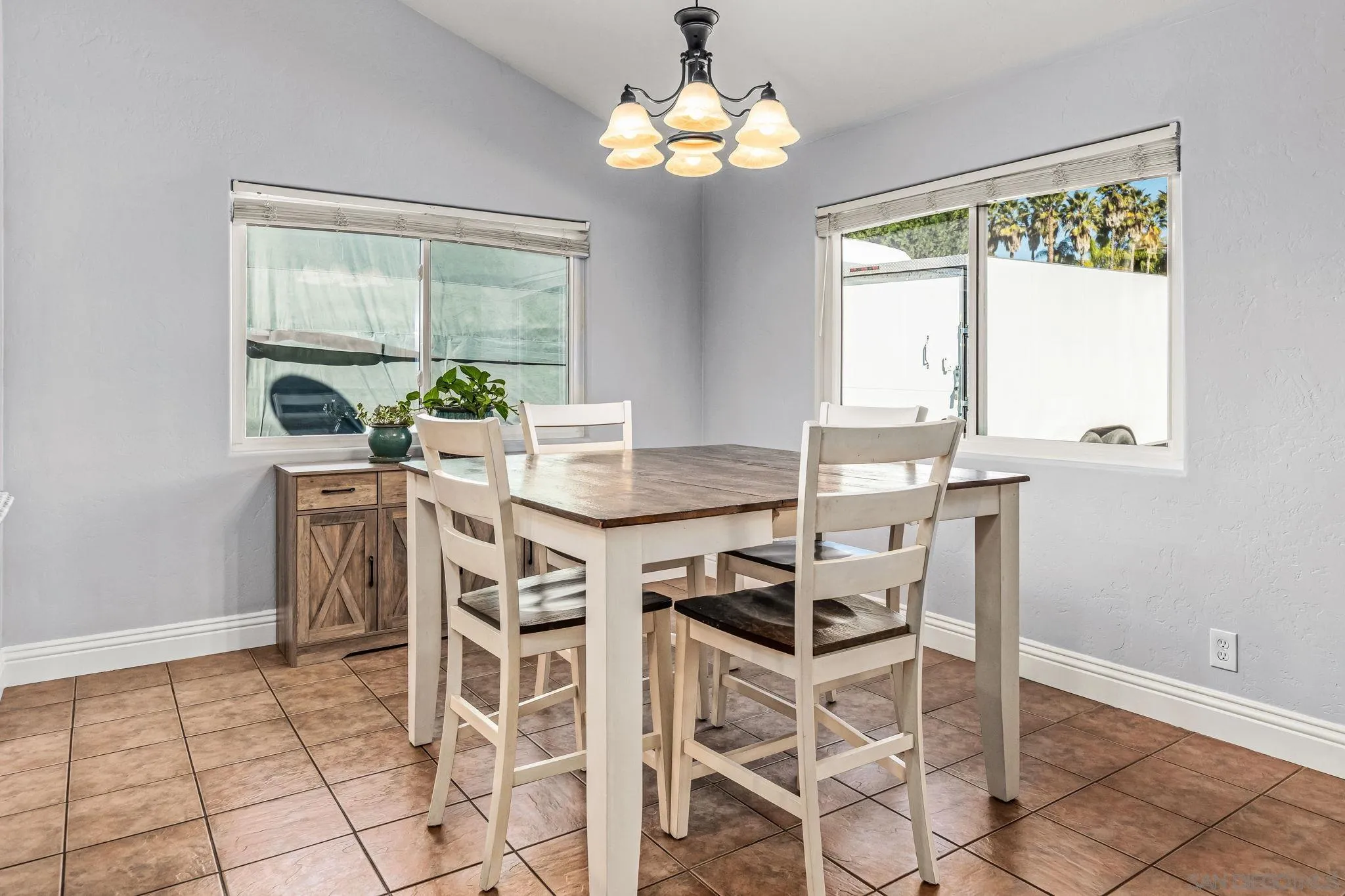 16319 Scarbery Road Ramona, CA 92065 - Photo 6 of 37 a view of a dining room with furniture a chandelier and wooden floor