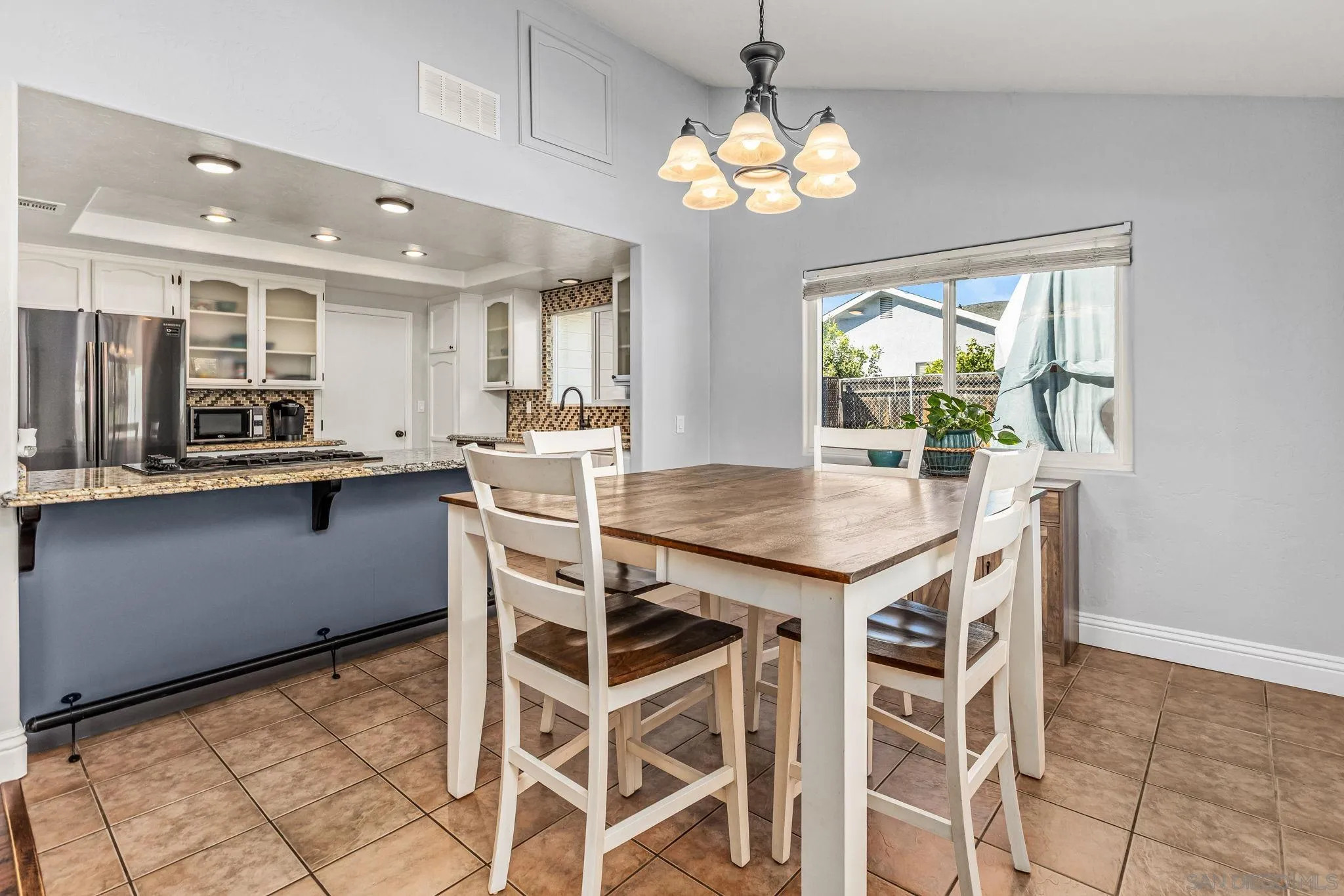 16319 Scarbery Road Ramona, CA 92065 - Photo 7 of 37 a view of a dining room with furniture and chandelier