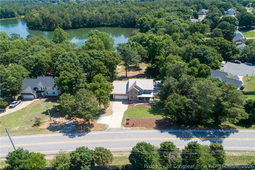 1075 Buffalo Lake Road Sanford, NC 27332 - Photo 45 of 49 an aerial view of a house with a yard and lake view