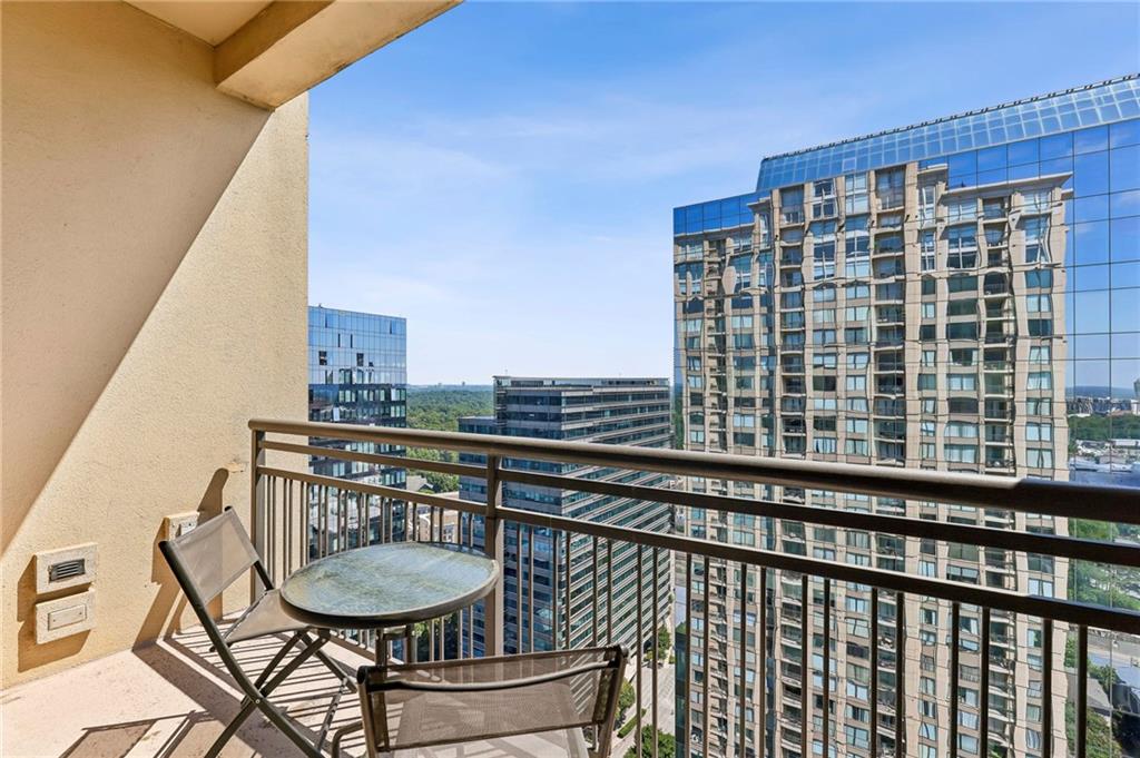 3445 Stratford Road Northeast, Unit 3105 Atlanta, GA 30326 - Photo 29 of 47 a view of a balcony with chairs