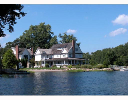 Undisclosed Address Old Greenwich, CT 06870 - Photo 2 of 8 a view of house with river and trees in the background