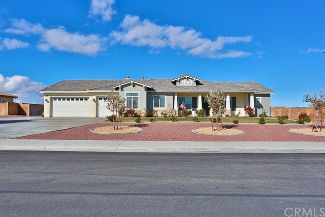 12346 Braeburn Road Apple Valley, CA 92308 - Photo 1 of 1 a front view of a residential apartment building with a yard