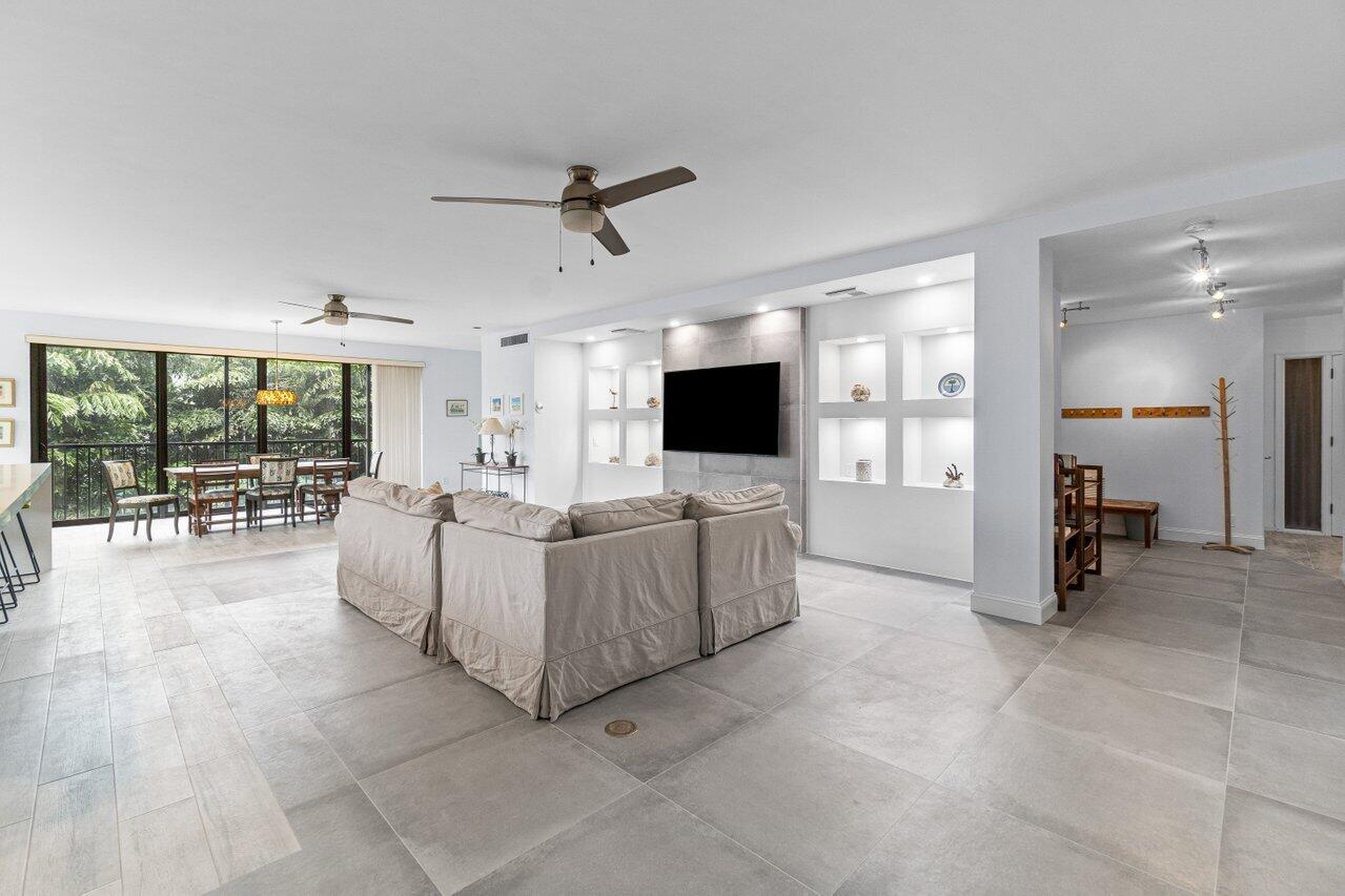122 Andrews Avenue, Unit 2A Delray Beach, FL 33483 - Photo 11 of 39 a living room with furniture and a flat screen tv