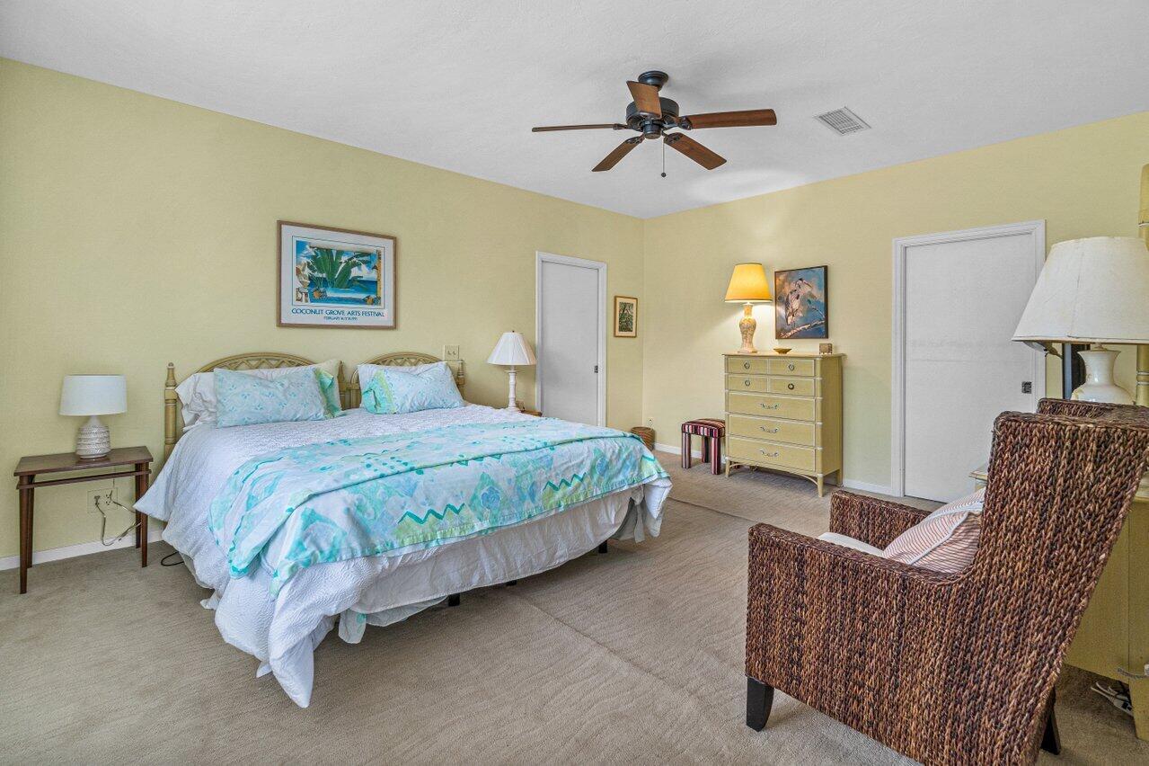122 Andrews Avenue, Unit 2A Delray Beach, FL 33483 - Photo 13 of 39 a spacious bedroom with a bed and furniture