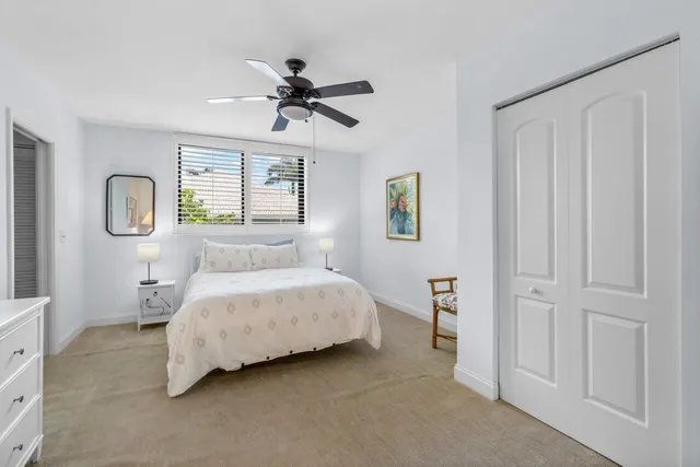 a living room with a bed furniture and a window