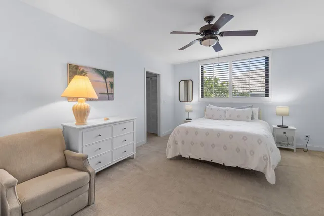 a bedroom with a bed dresser and a window