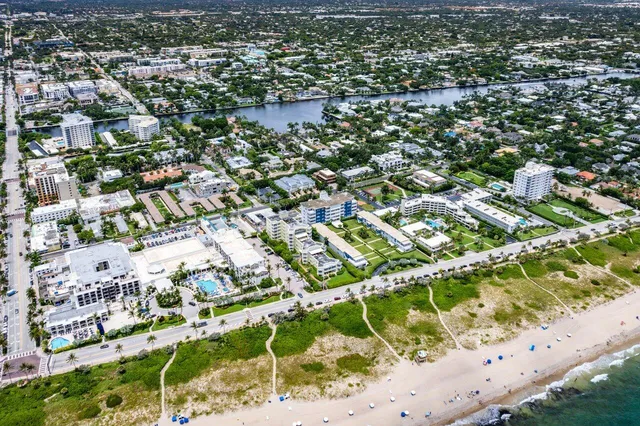 an aerial view of residential houses with outdoor space