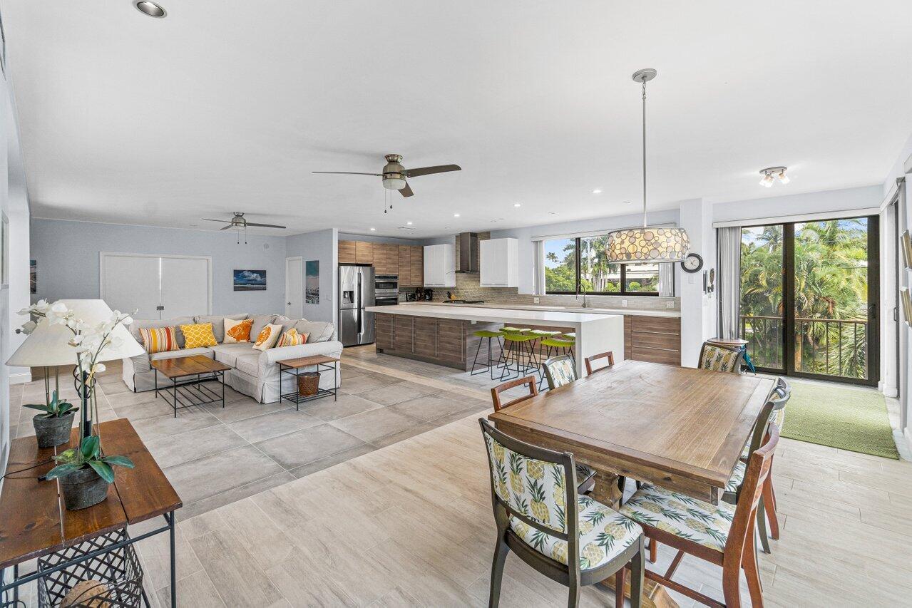 122 Andrews Avenue, Unit 2A Delray Beach, FL 33483 - Photo 6 of 39 a living room with furniture kitchen view and a large window