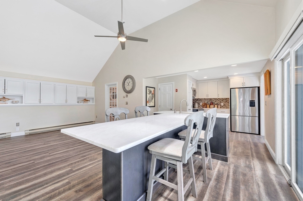118 Woolford Road Wrentham, MA 02093 - Photo 21 of 41 a view of a dining room with furniture and a kitchen view