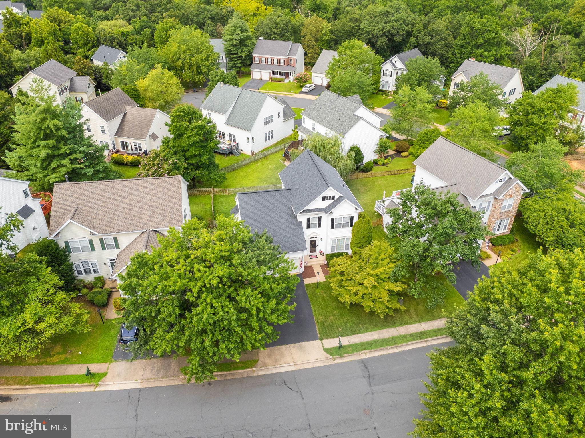 9744 Runner Stone Place Bristow, VA 20136 - Photo 2 of 38 an aerial view of residential houses with outdoor space