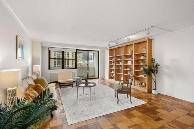 a living room with furniture and a window