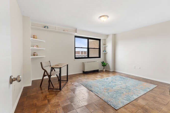 2 Hawthorne Place, Unit 16M Boston, MA 02114 - Photo 16 of 36 an empty room with windows and bench