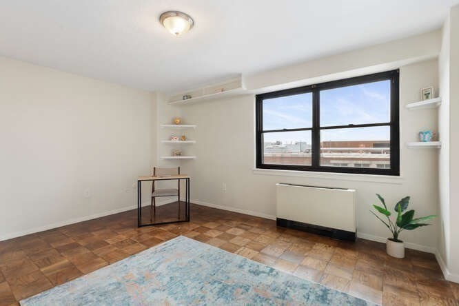 2 Hawthorne Place, Unit 16M Boston, MA 02114 - Photo 17 of 36 an empty room with windows and mountain view