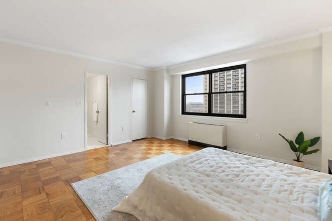 2 Hawthorne Place, Unit 16M Boston, MA 02114 - Photo 20 of 36 a bedroom with a bed and a window