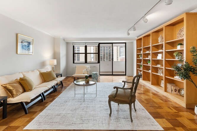 2 Hawthorne Place, Unit 16M Boston, MA 02114 - Photo 2 of 36 a living room with furniture and a window