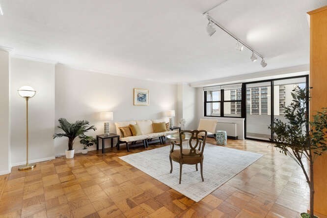 2 Hawthorne Place, Unit 16M Boston, MA 02114 - Photo 3 of 36 a living room with furniture potted plant and window