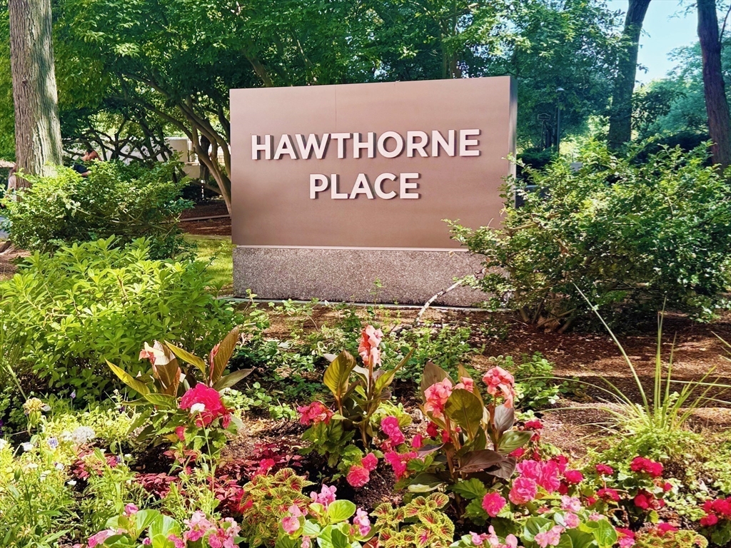 2 Hawthorne Place, Unit 16M Boston, MA 02114 - Photo 34 of 36 a sign that is sitting in front of flowers