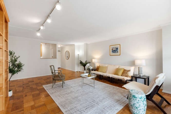 2 Hawthorne Place, Unit 16M Boston, MA 02114 - Photo 4 of 36 a living room with furniture and wooden floor