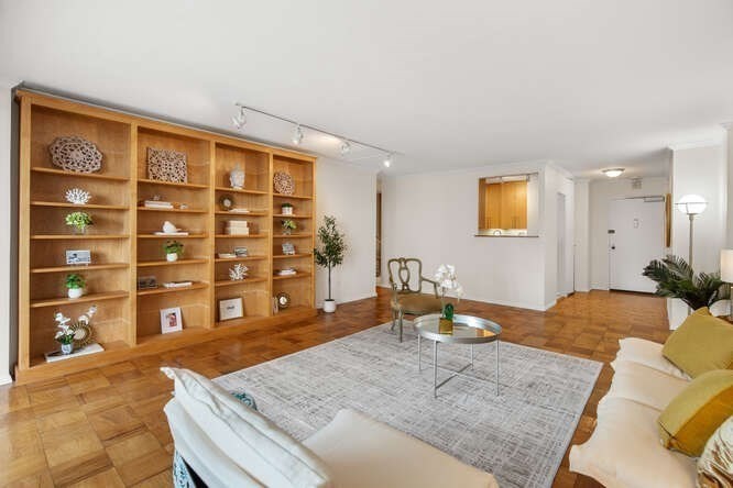 2 Hawthorne Place, Unit 16M Boston, MA 02114 - Photo 5 of 36 a bedroom with a bed dresser and a wooden floor