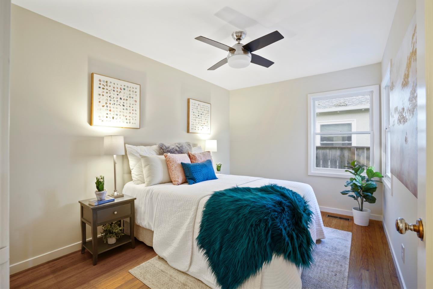 3755 Bay Road Menlo Park, CA 94025 - Photo 15 of 29 a bedroom with a large bed and a potted plant