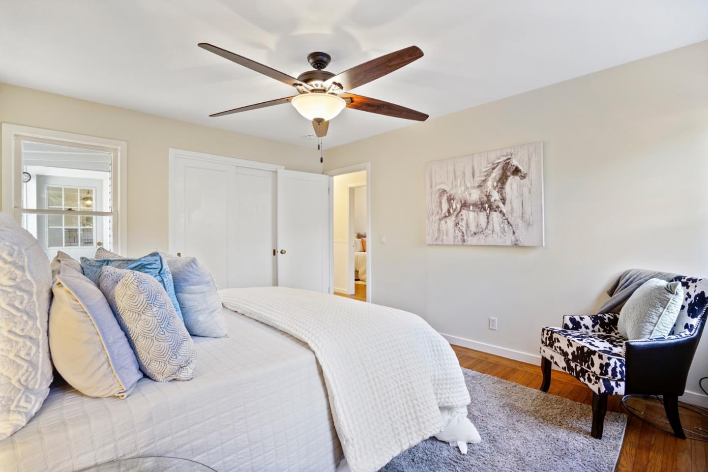 3755 Bay Road Menlo Park, CA 94025 - Photo 19 of 29 a bedroom with a bed and a chandelier