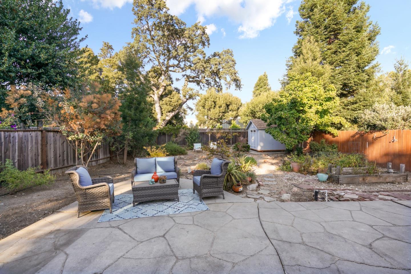 3755 Bay Road Menlo Park, CA 94025 - Photo 24 of 29 a view of backyard with outdoor seating and trees
