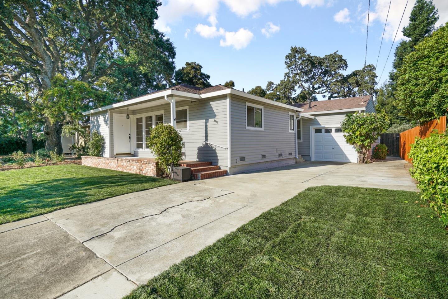 3755 Bay Road Menlo Park, CA 94025 - Photo 4 of 29 a front view of a house with garden