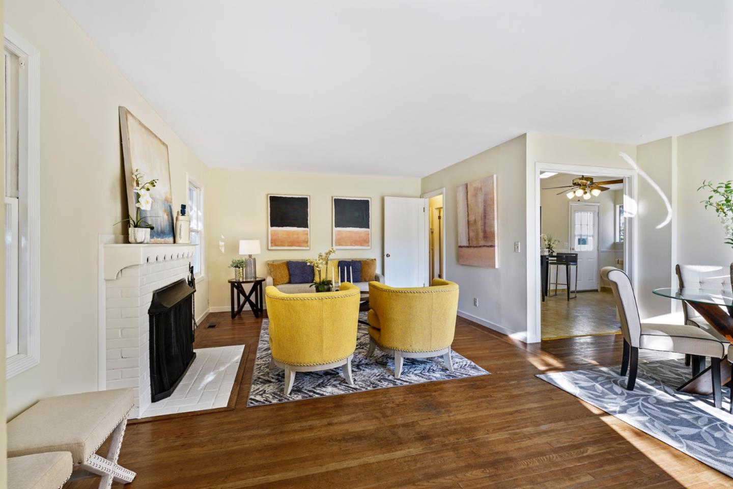 3755 Bay Road Menlo Park, CA 94025 - Photo 7 of 29 a living room with furniture a fireplace and a table