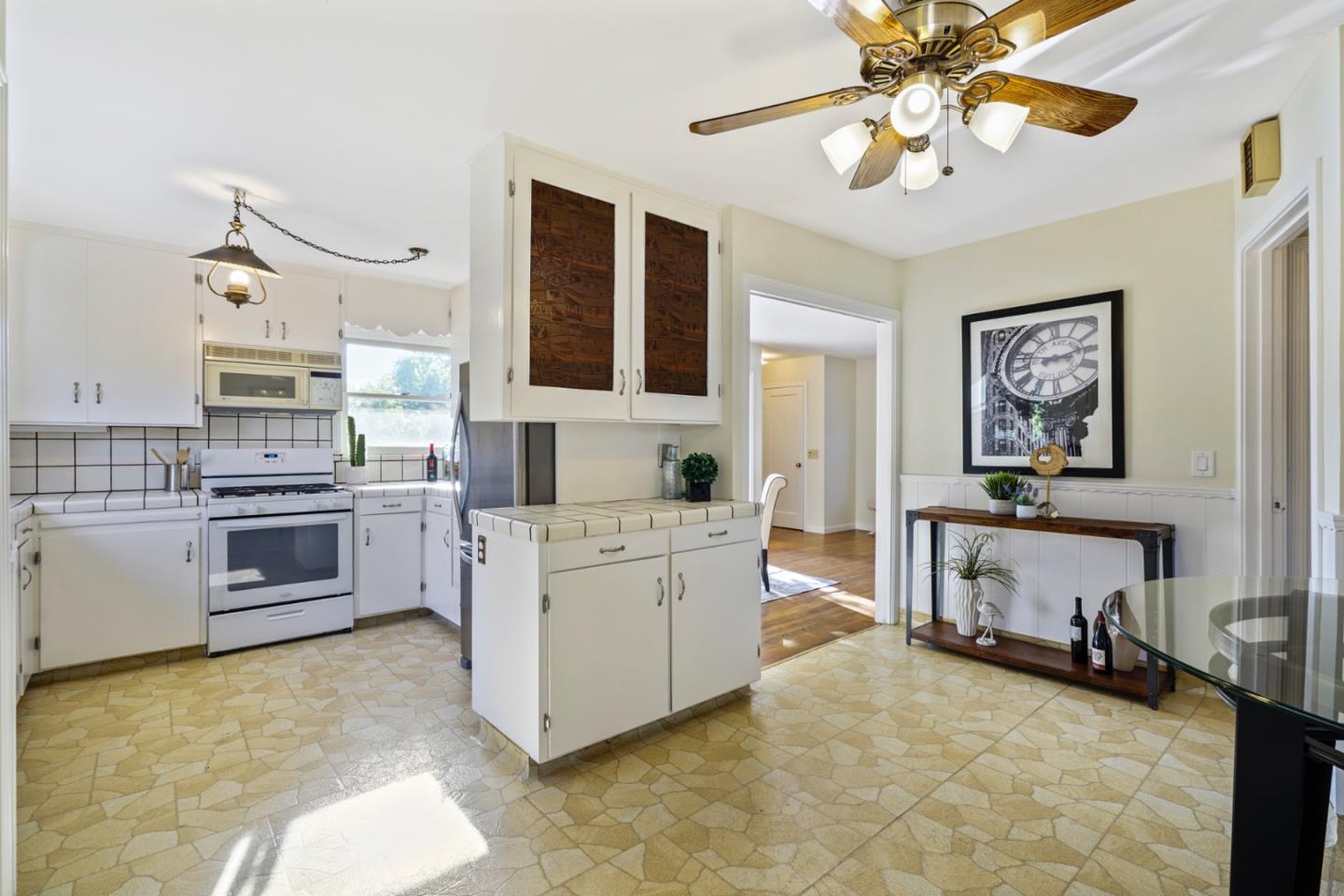 3755 Bay Road Menlo Park, CA 94025 - Photo 10 of 29 a kitchen with cabinets stainless steel appliances and a counter top space