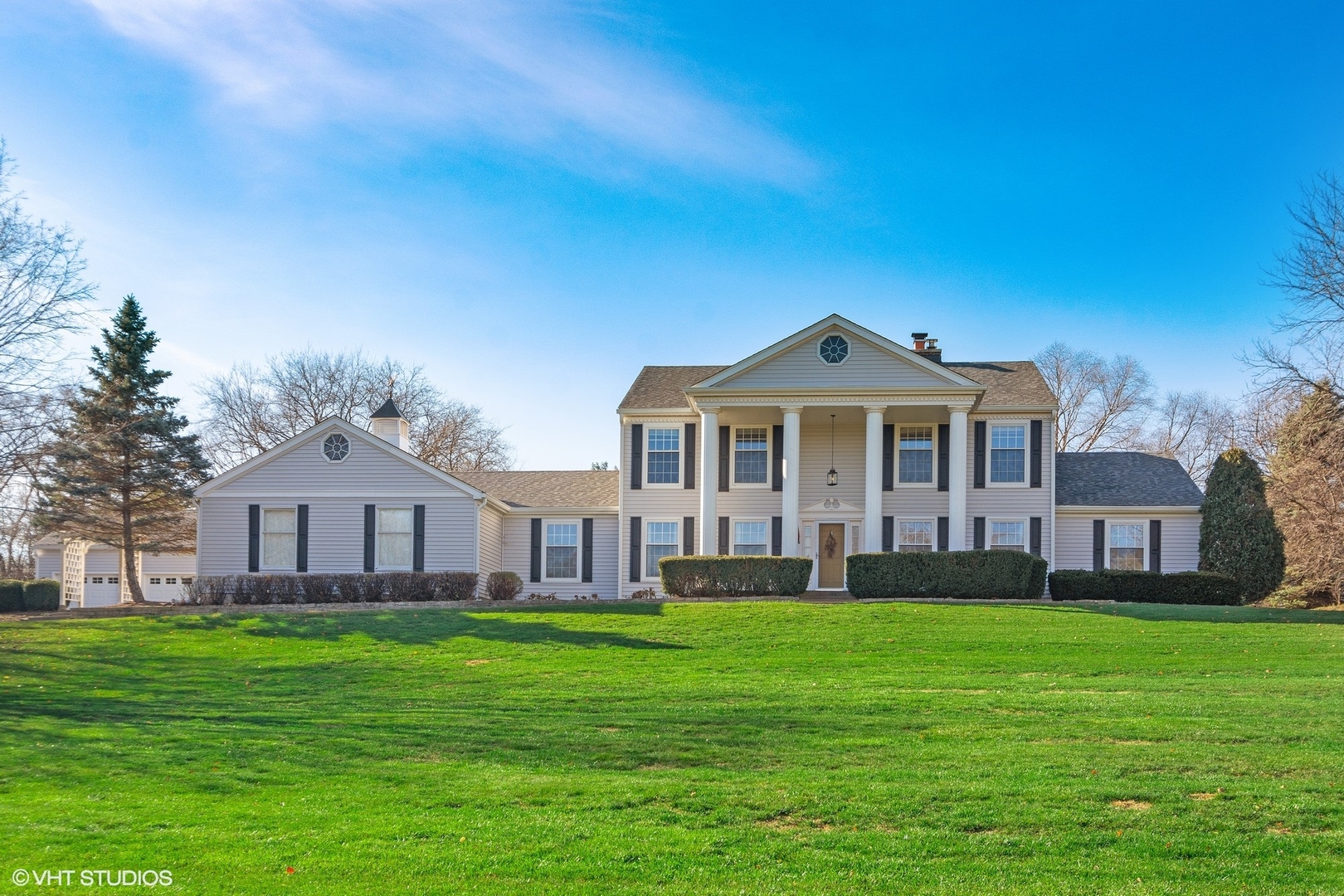 924 Stonefield Circle Inverness, IL 60067 - Photo 1 of 50 a front view of a house with a garden and yard