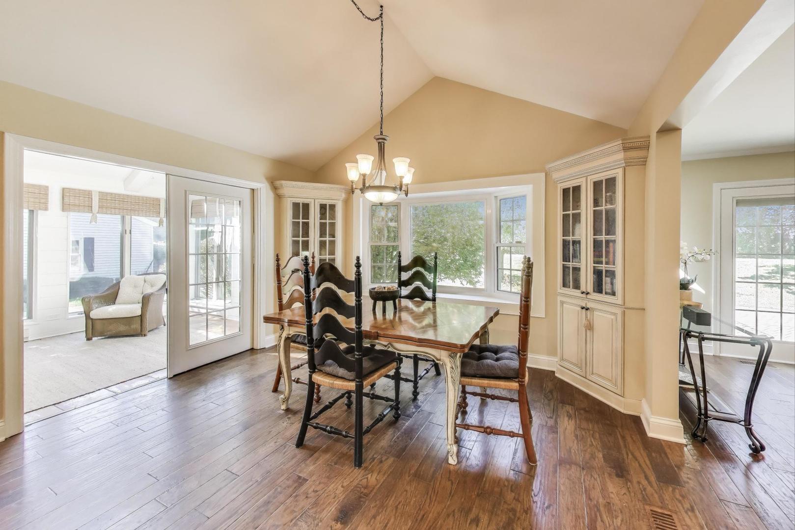 924 Stonefield Circle Inverness, IL 60067 - Photo 12 of 50 a view of a dining room with furniture window and wooden floor