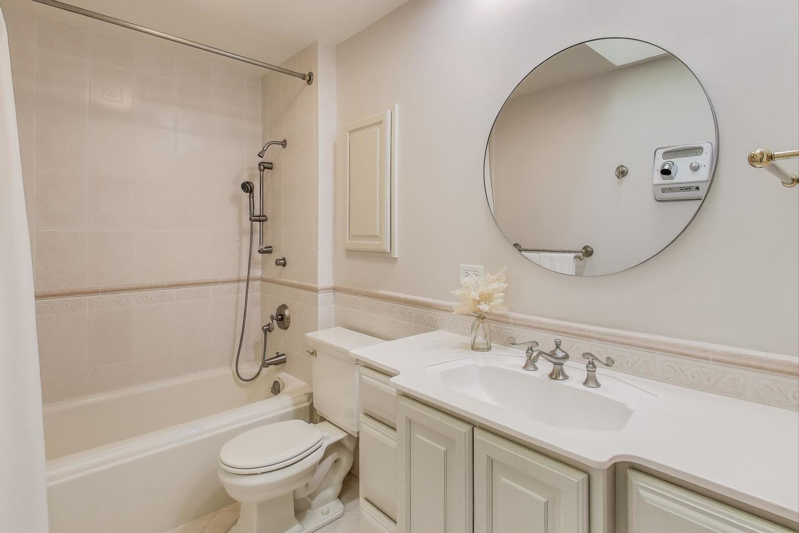924 Stonefield Circle Inverness, IL 60067 - Photo 31 of 50 a bathroom with a sink and a mirror