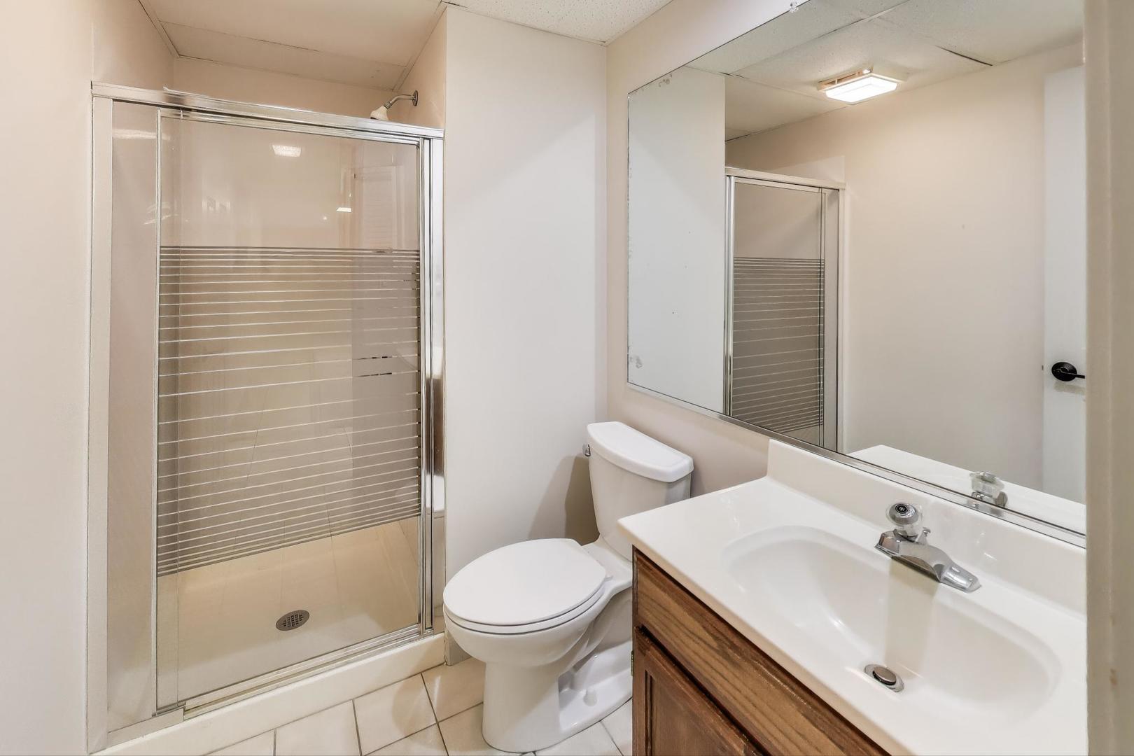 924 Stonefield Circle Inverness, IL 60067 - Photo 37 of 50 a bathroom with a sink and a mirror