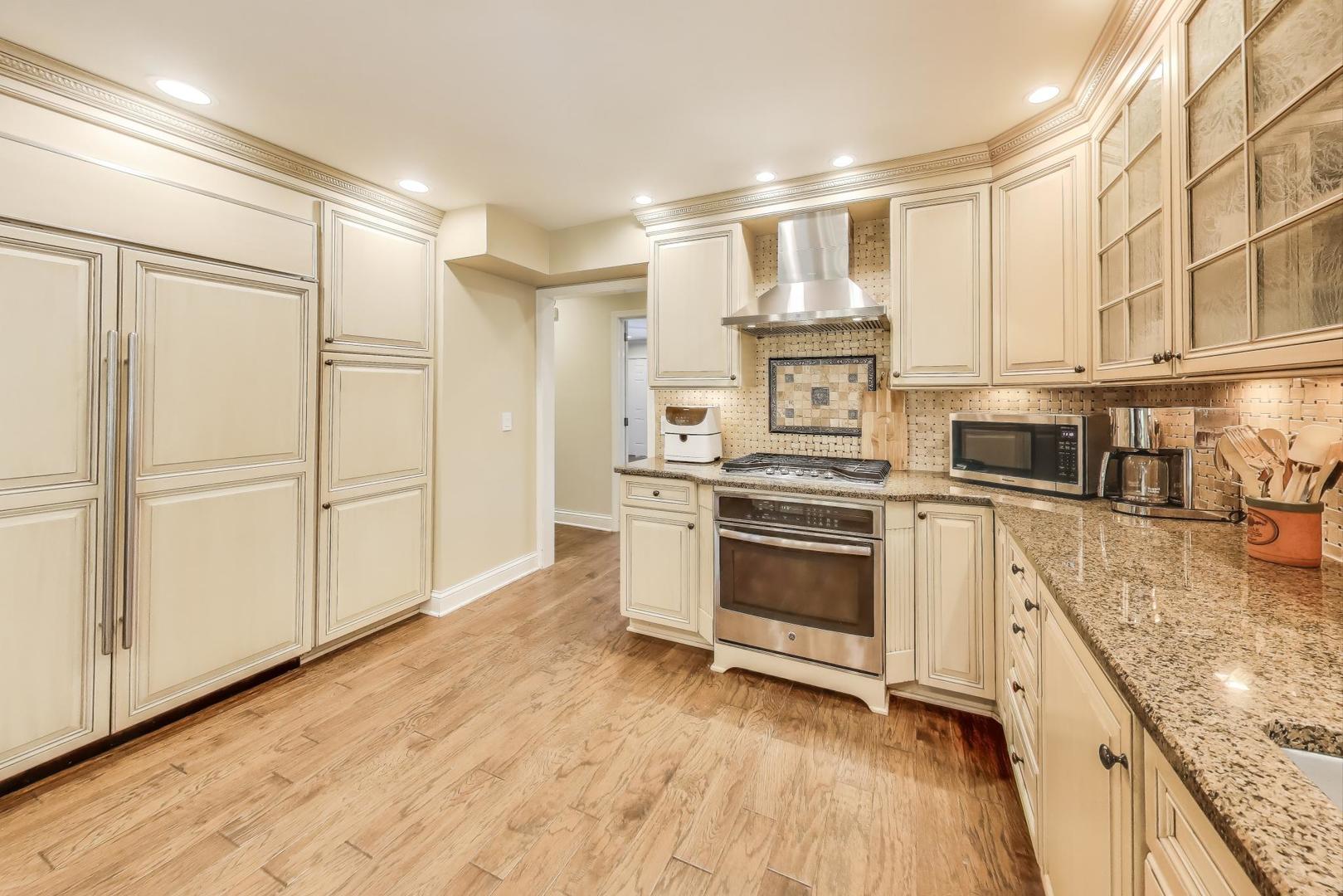 924 Stonefield Circle Inverness, IL 60067 - Photo 10 of 50 a kitchen with stainless steel appliances granite countertop a stove and a refrigerator
