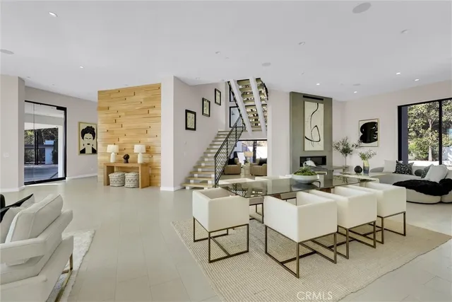 a kitchen with stainless steel appliances kitchen island granite countertop a sink and cabinets