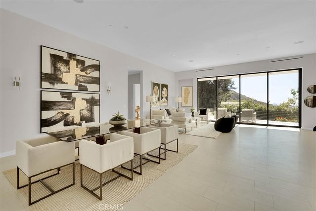 a kitchen with stainless steel appliances a stove sink and cabinets