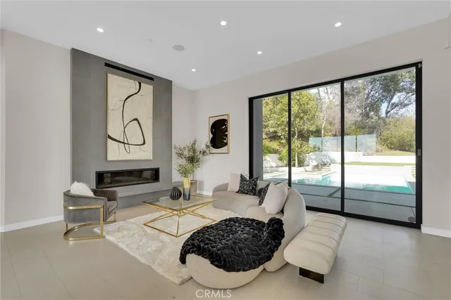 a bathroom with a sink mirror and toilet