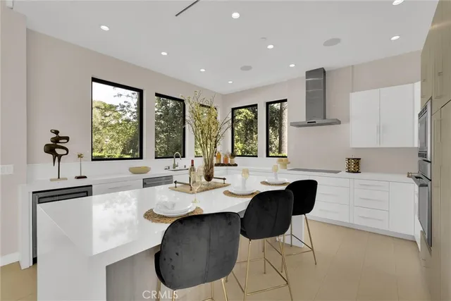 a white toilet sitting next to a bathroom sink