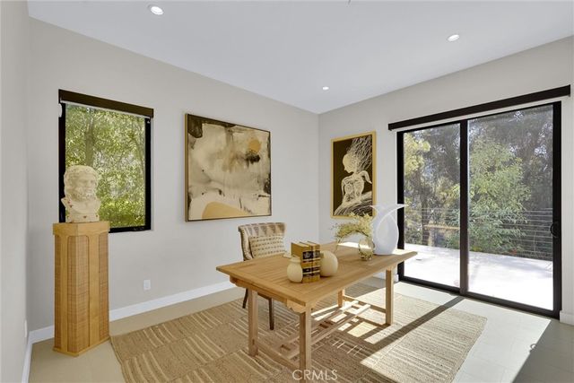 a bed room with a bed and a large window