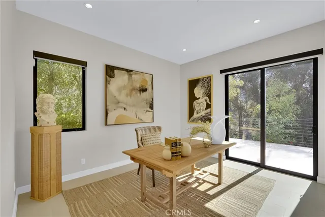 a bed room with a bed and a large window